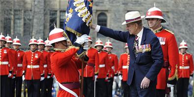 His Royal Highness Prince Philip, The Duke of Edinburgh (HRH), presents new regimental colours to the 3rd Battalion, The Royal Canadian Regiment. Photo: Sergeant Colin Kelley, Royal Canadian Air Force 